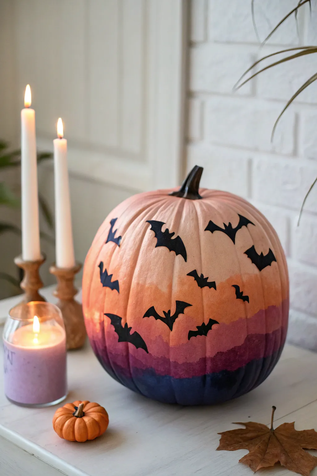 Glowing bat silhouettes on a sunset to midnight gradient pumpkin, minimalist autumn magic.