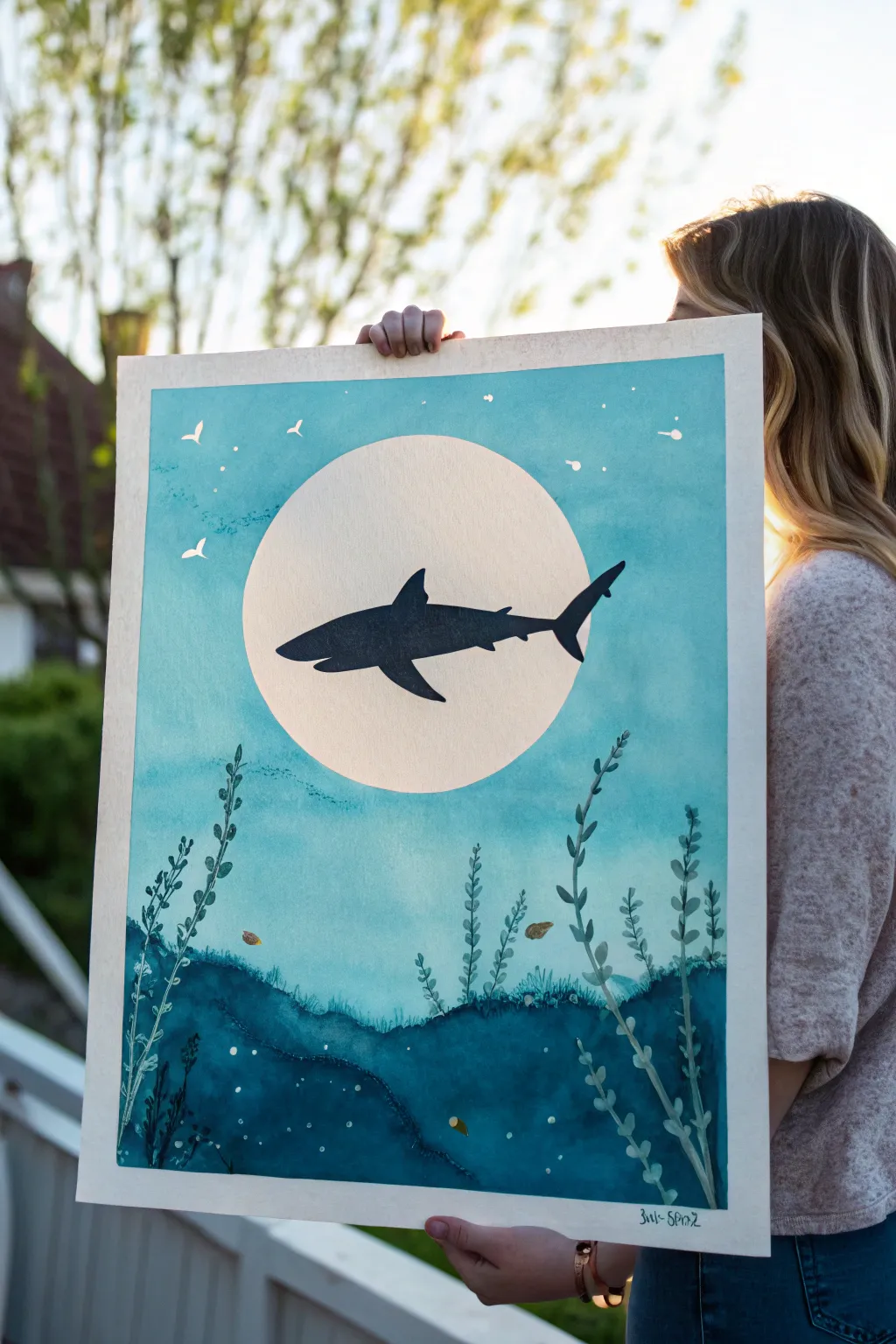 Minimal shark silhouette gliding across a glowing sun on a serene blue-turquoise wash