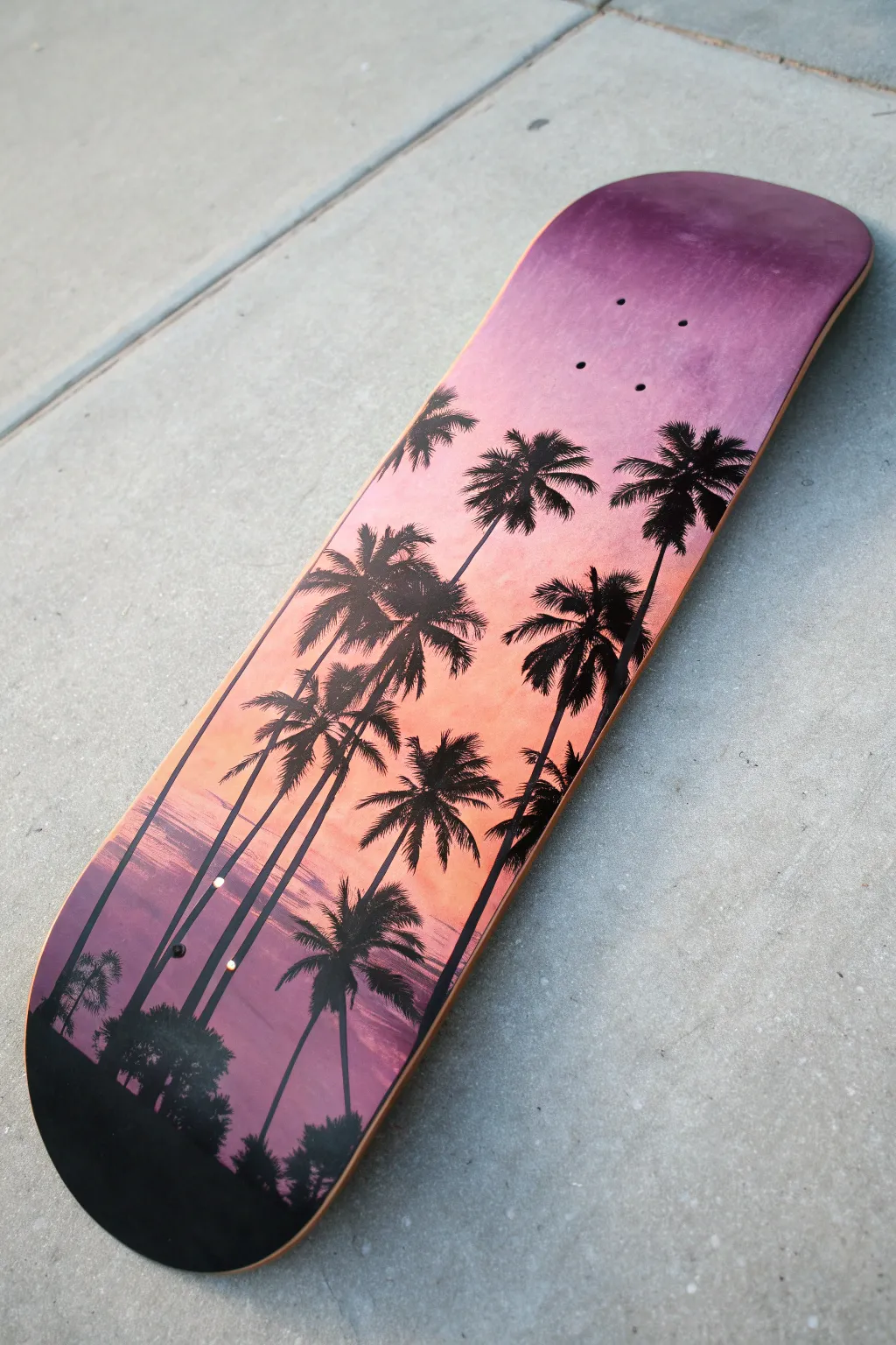 Sunset palm silhouette skateboard deck with a soft pink-to-purple gradient, minimal and boho