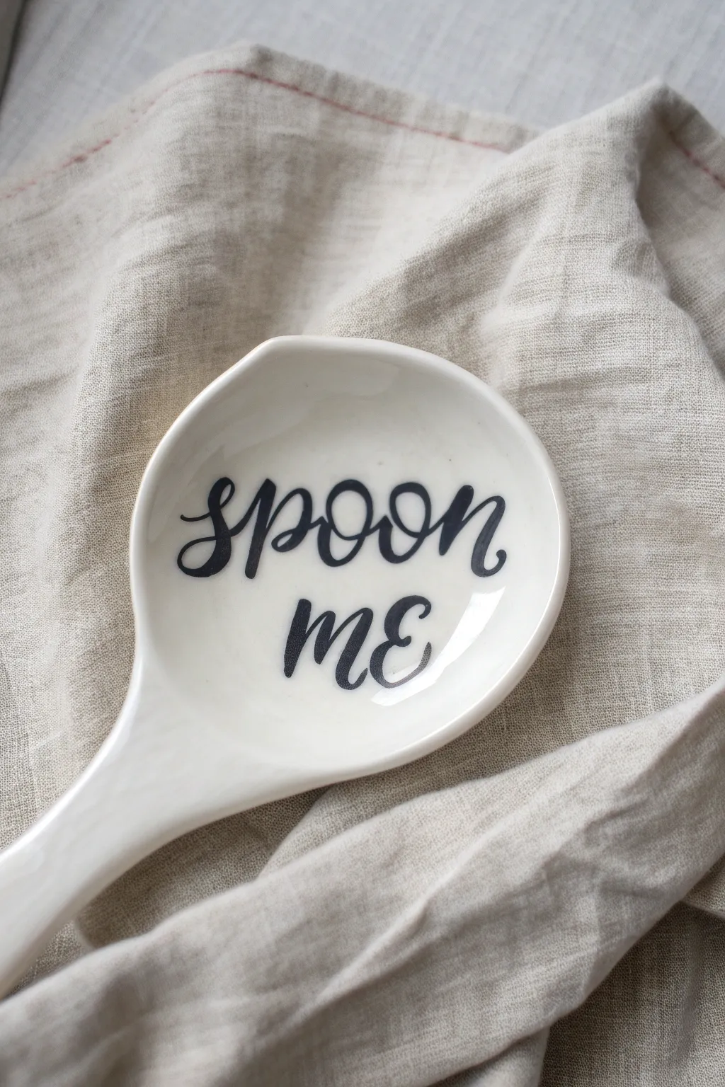 Add a playful touch to your kitchen counter with this cheeky hand-painted spoon rest design.