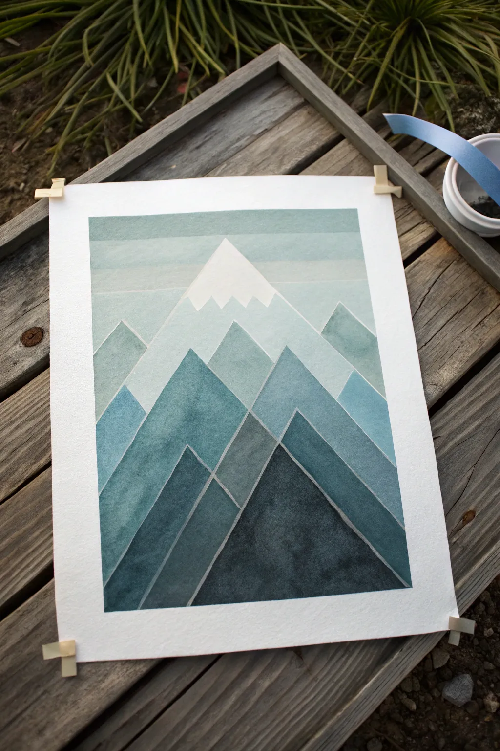 Triangle mountain tape art with crisp ridge lines, misty gradients, and clean snowcap negative space