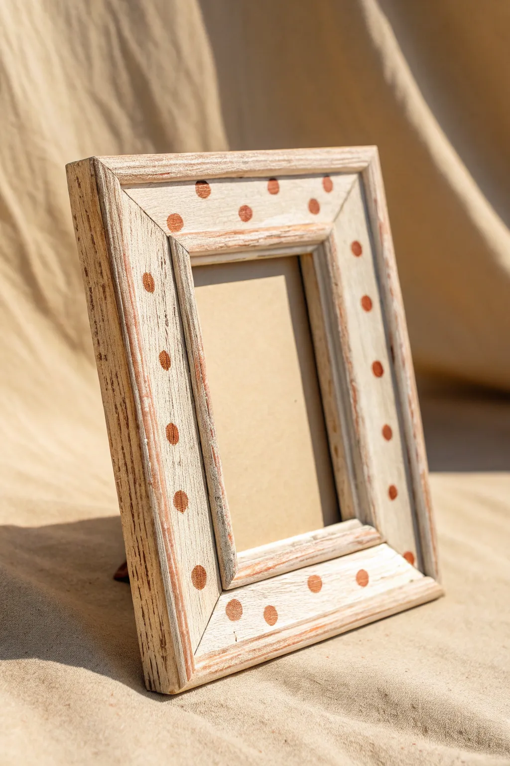 Playful polka dots and speckled texture on a hand painted wooden frame, clean boho vibes.
