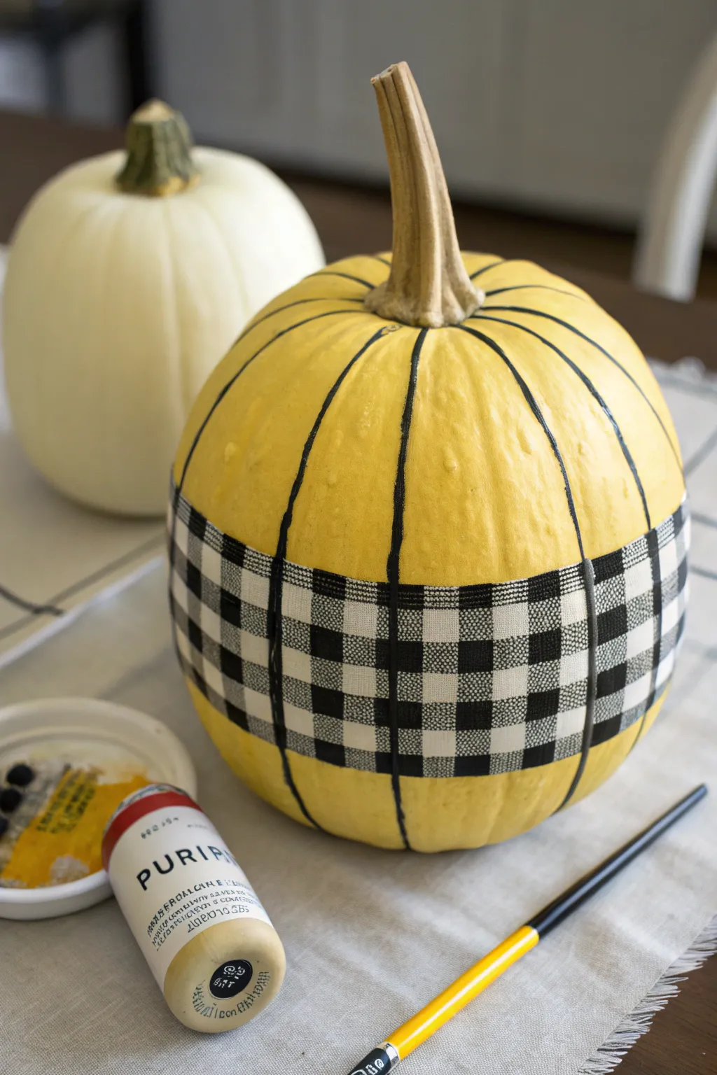 Minimalist buffalo plaid yellow pumpkin accent with crisp black and white grid details