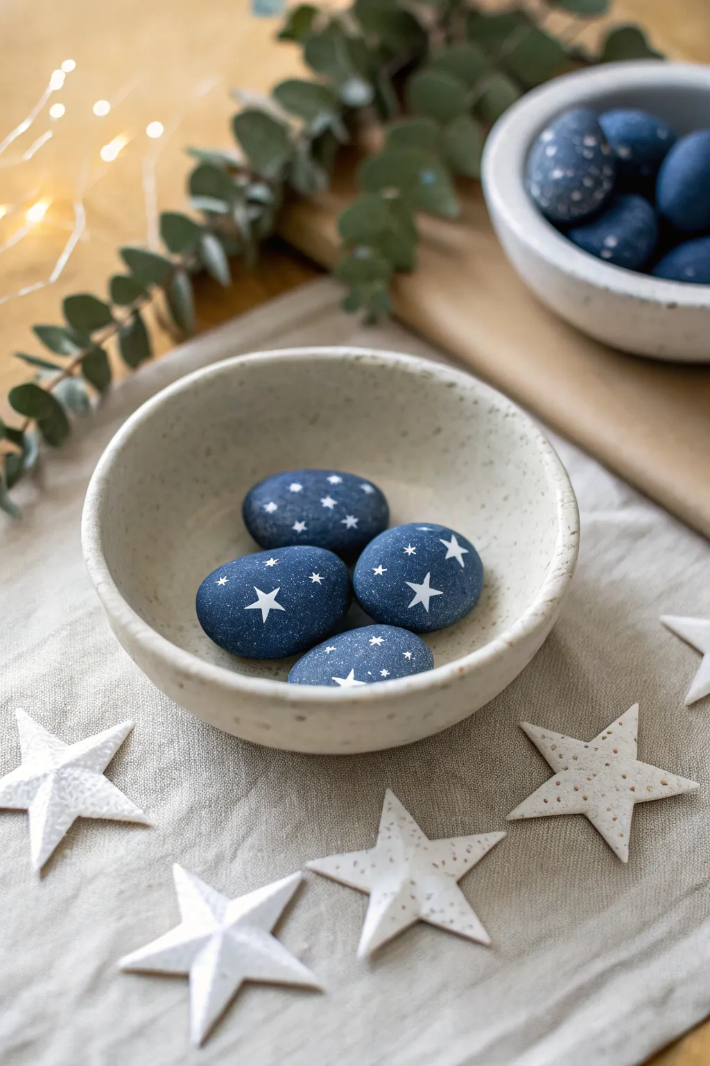 Tiny star-spangled blue mini rocks in a simple dish, minimalist and festive for July 4th.