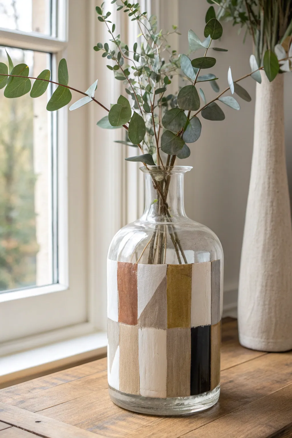 Neutral color-block glass vase with one stem, Scandinavian minimalism with a soft boho touch