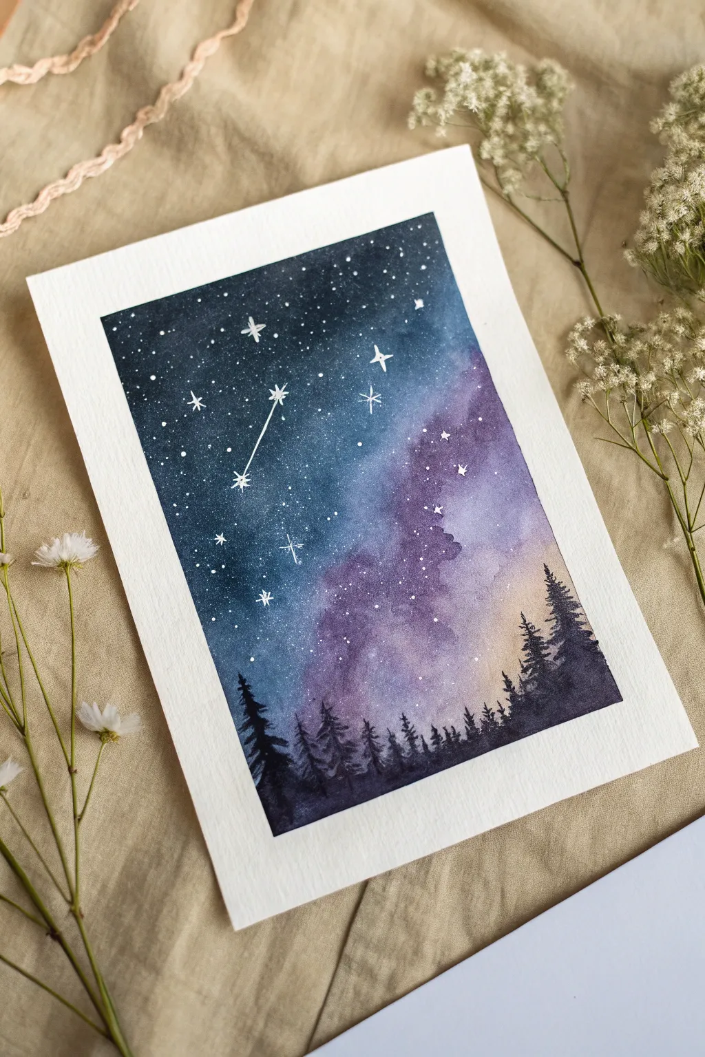 Night sky galaxy wash with dreamy splatter stars, a simple beginner painting idea.