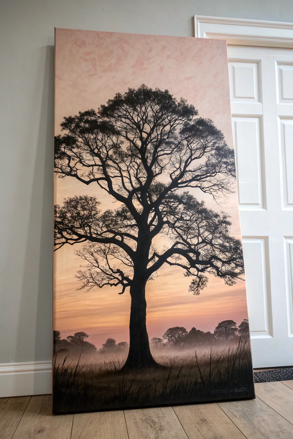 Easy big canvas idea: a single oversized tree silhouette on a soft sunset wash, bold and calm