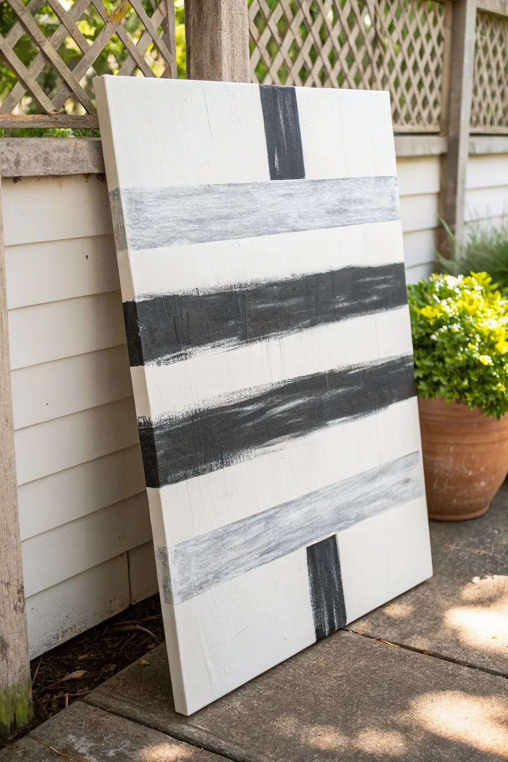Bold black brushstrokes on white canvas for a minimalist abstract statement with soft gray depth.