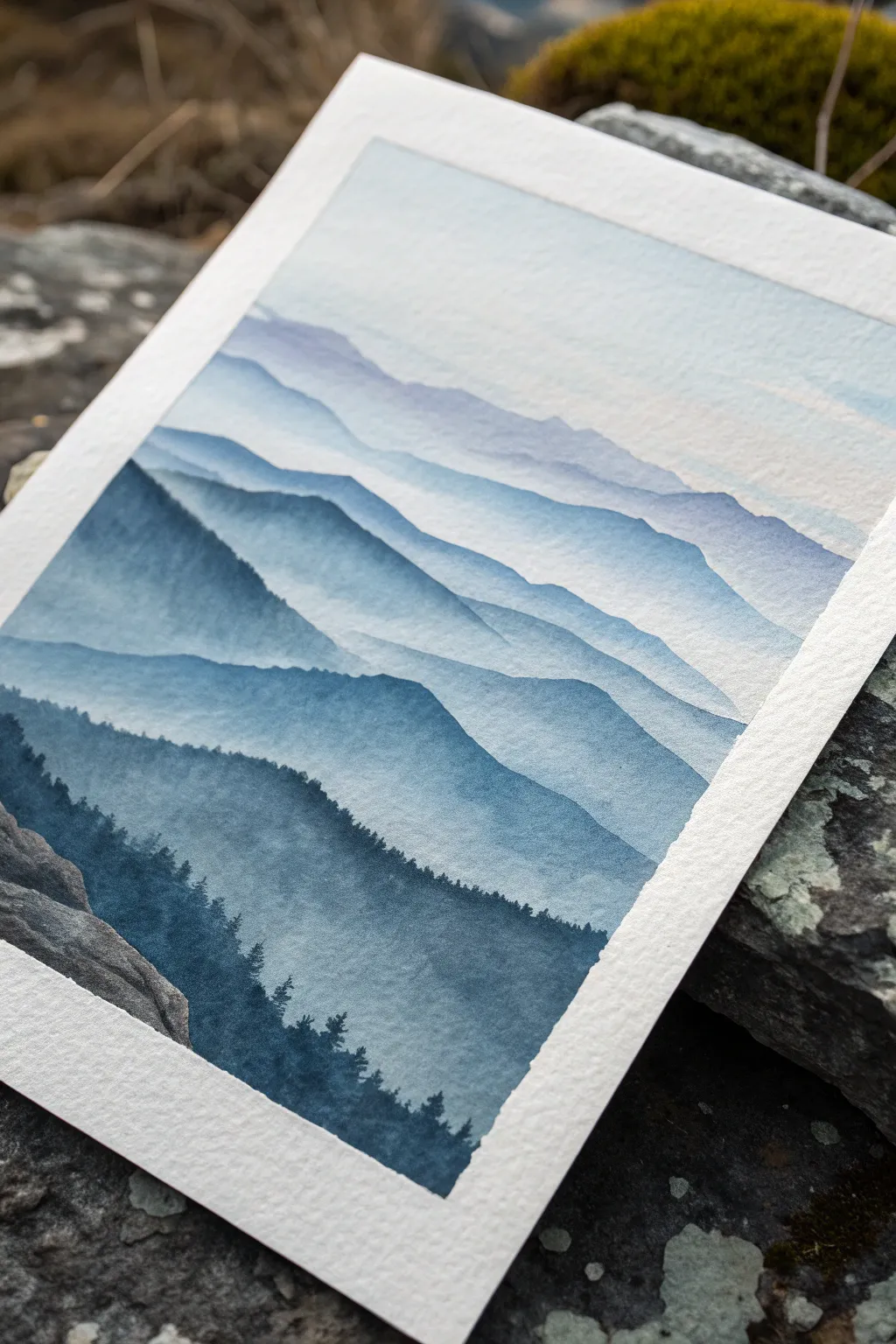 Misty mountain layers with soft atmospheric blending, fading lighter into the distance for depth.