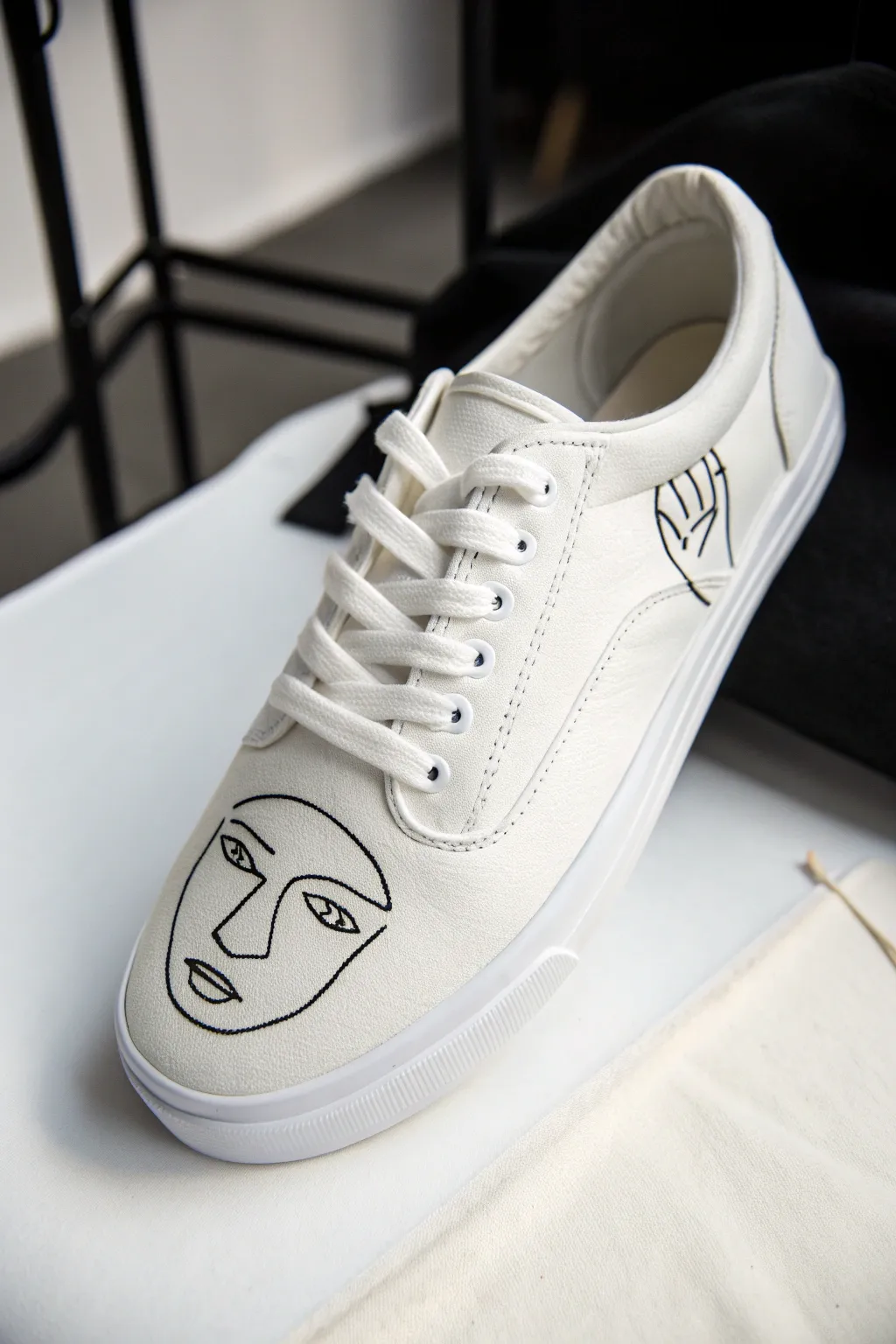 Clean black line art face on white canvas sneaker, minimalist Scandinavian boho DIY style