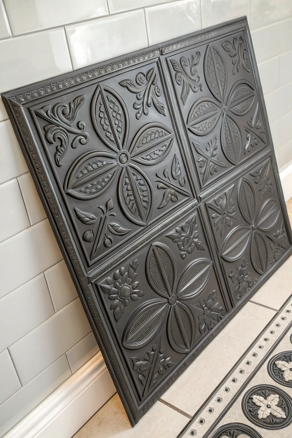 Faux tin look on a flat ceiling tile with charcoal base and soft silver dry-brush highlights.