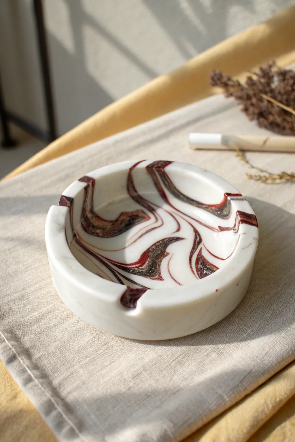 Glossy marbled polymer clay ashtray with bold swirls and clean notches, minimal boho vibe.