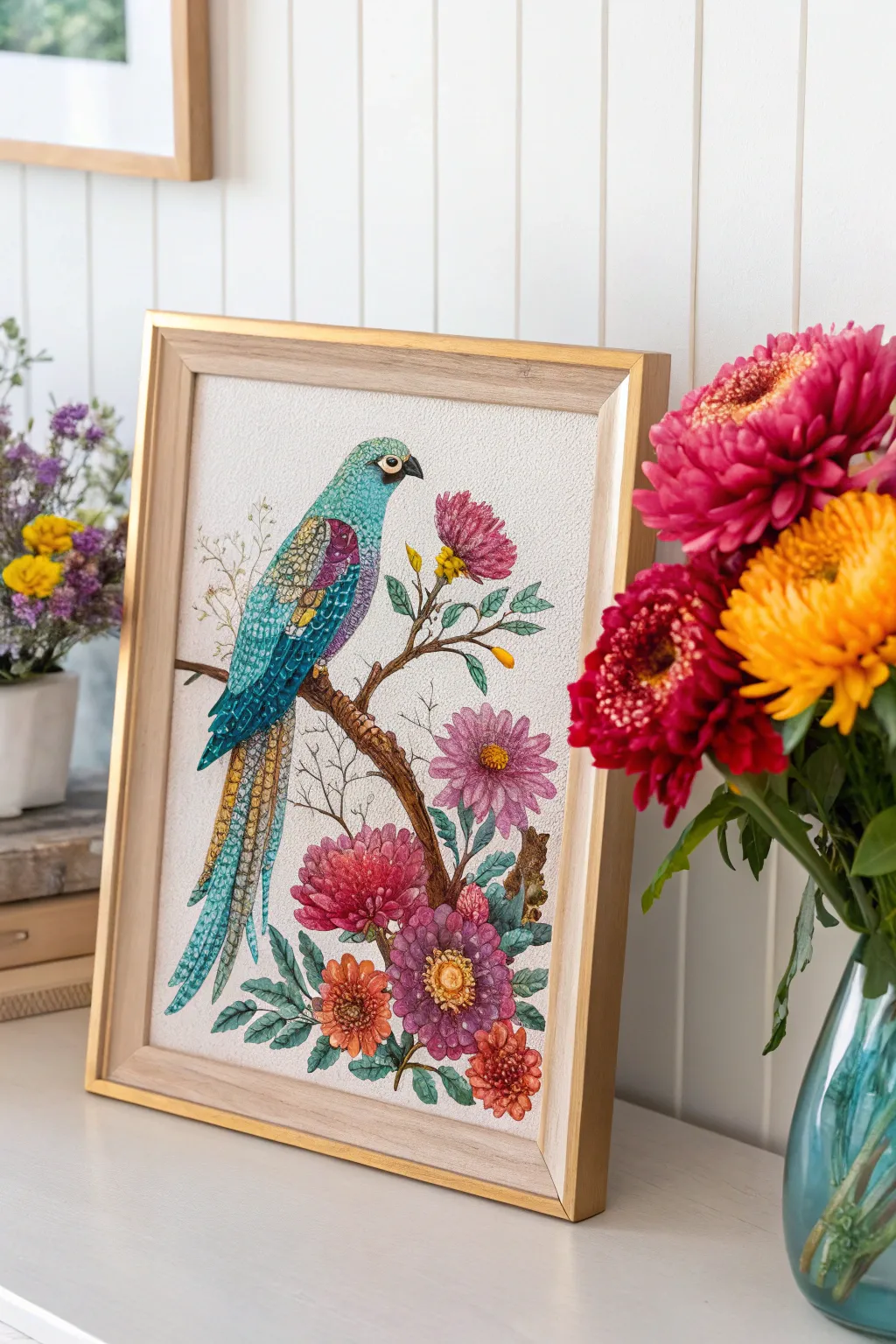 Gem-like diamond painting bird with bold florals, glowing under warm light in a minimal setting