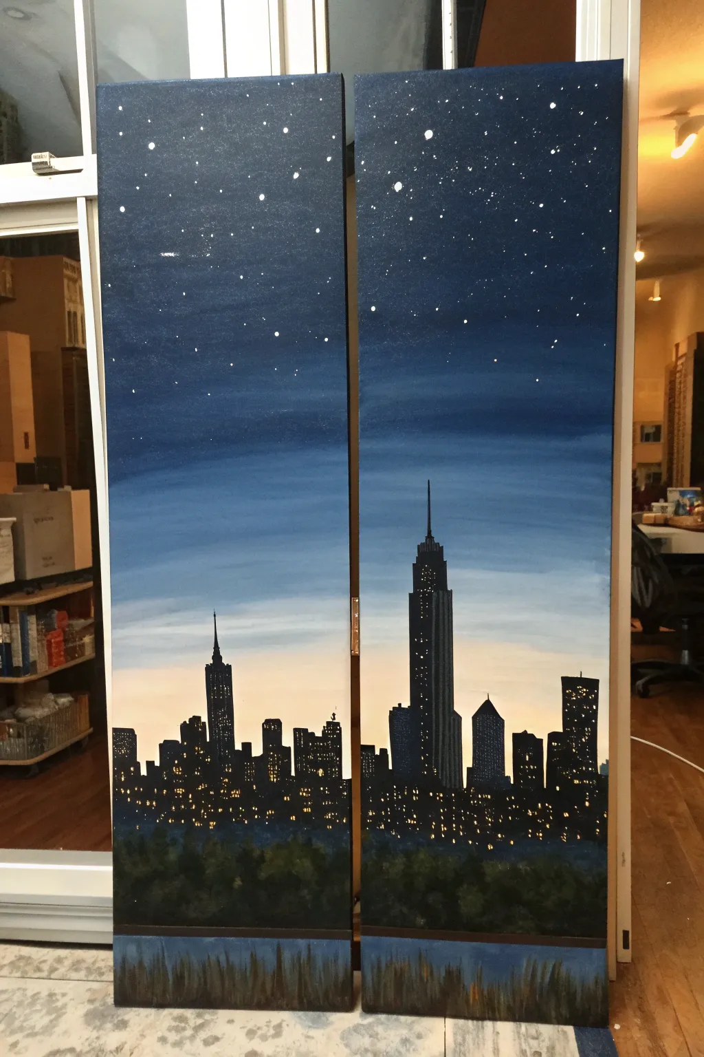 Minimalist diptych skyline painting, two panels aligned with warm city lights and clean contrast