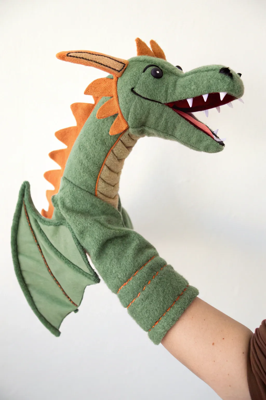 Handcrafted glove dragon puppet with a long neck tube, minimalist boho style and crisp contrast