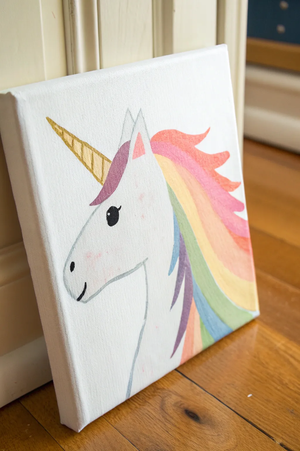 Simple unicorn head with a rainbow acrylic mane, perfect for kids to practice easy color blending.