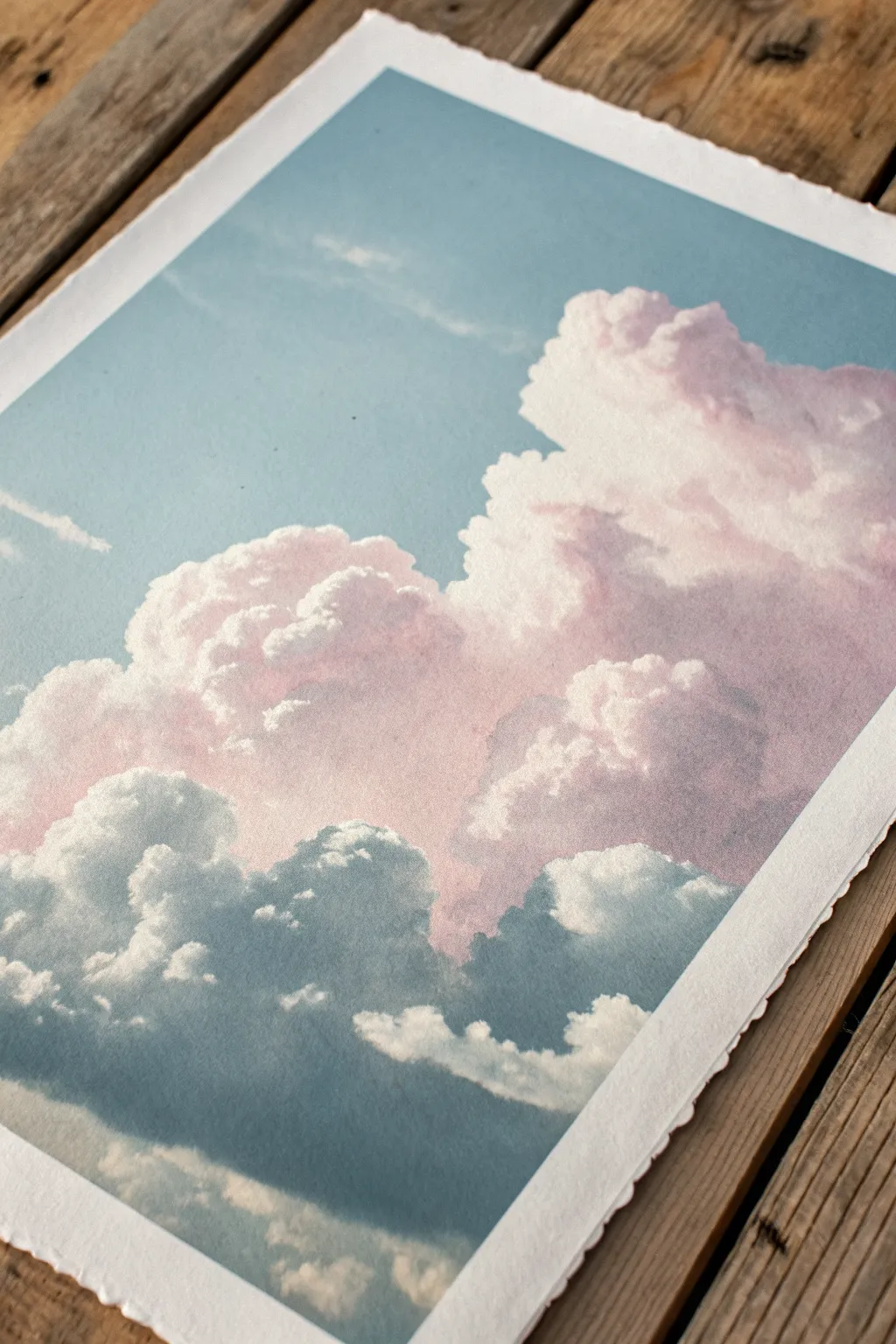 Soft pastel cloud study with visible finger-smudge highlights in a calm Scandinavian palette