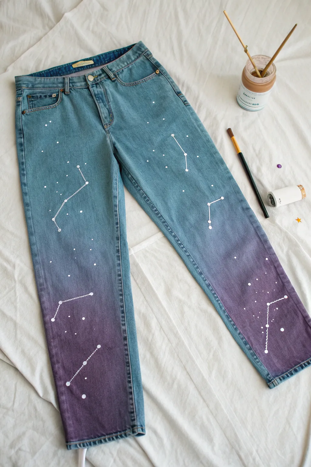 DIY galaxy jeans with splattered stars and simple constellations for an easy fabric paint upgrade