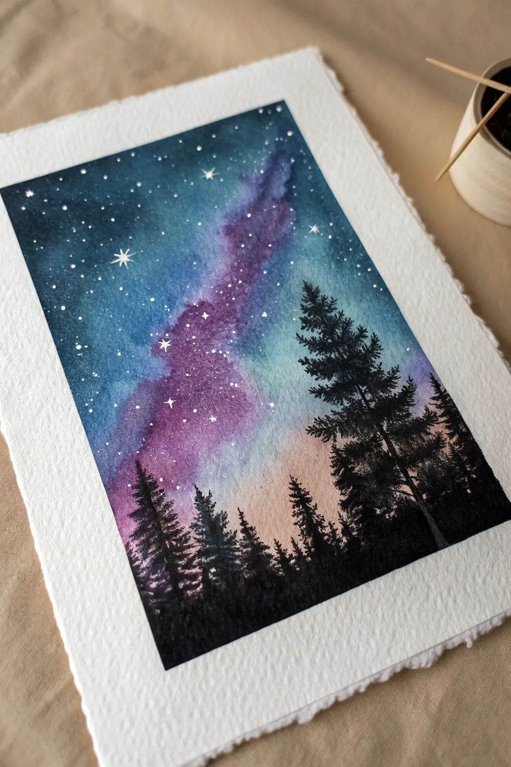 Dreamy galaxy sky painting with crisp pine silhouettes for an easy, high-contrast night scene.