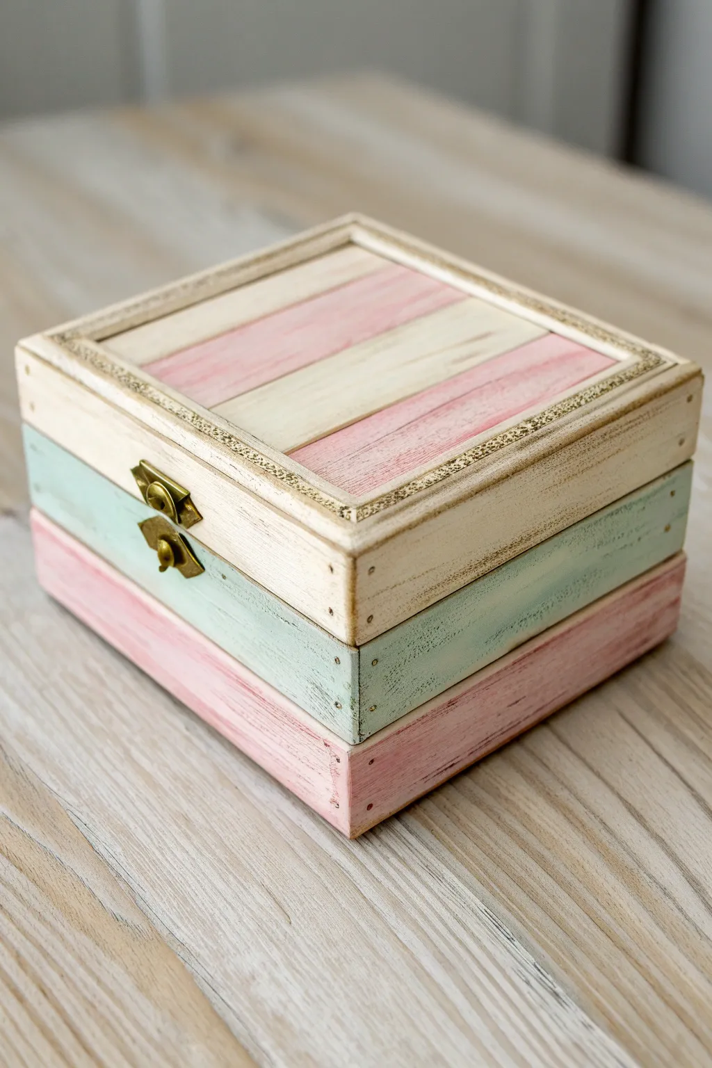 Shabby chic pastel jewelry box with softly distressed edges, perfect for a cozy vanity vignette.