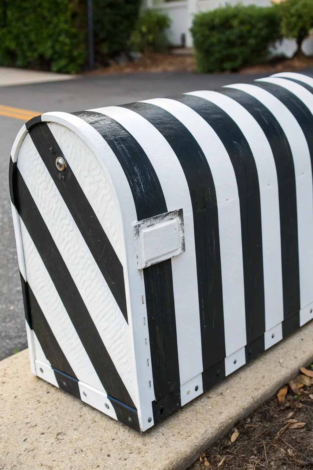 Crisp black-and-white striped mailbox for an instant modern look, clean and minimalist.