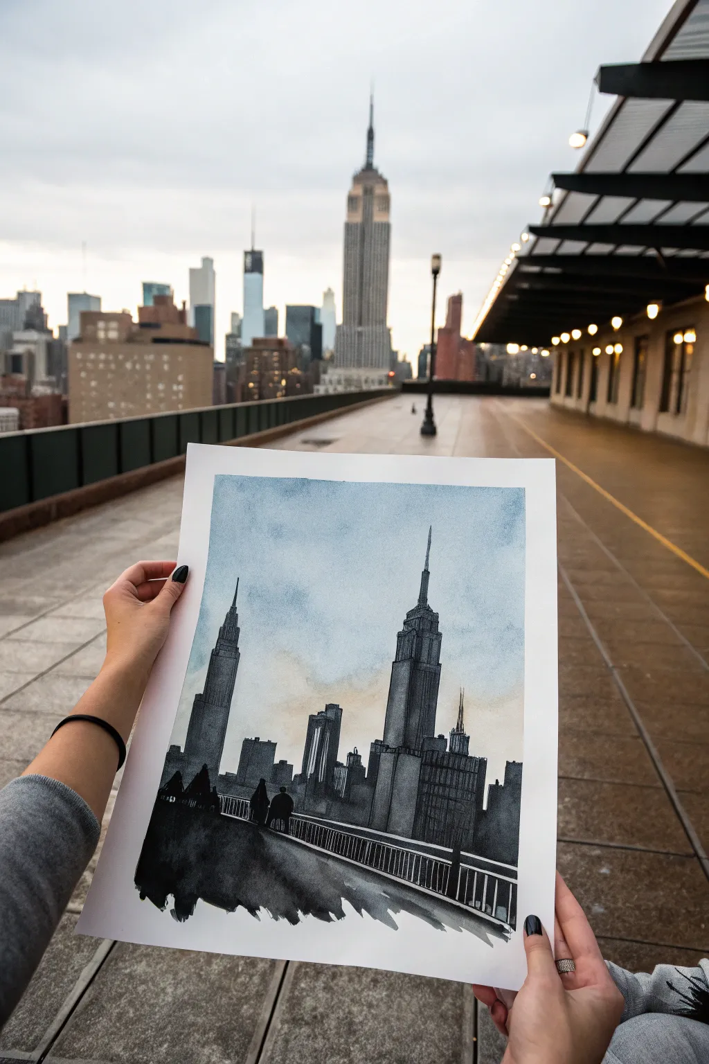 Bold ink wash skyline silhouette with a soft watery sky and a few crisp line details