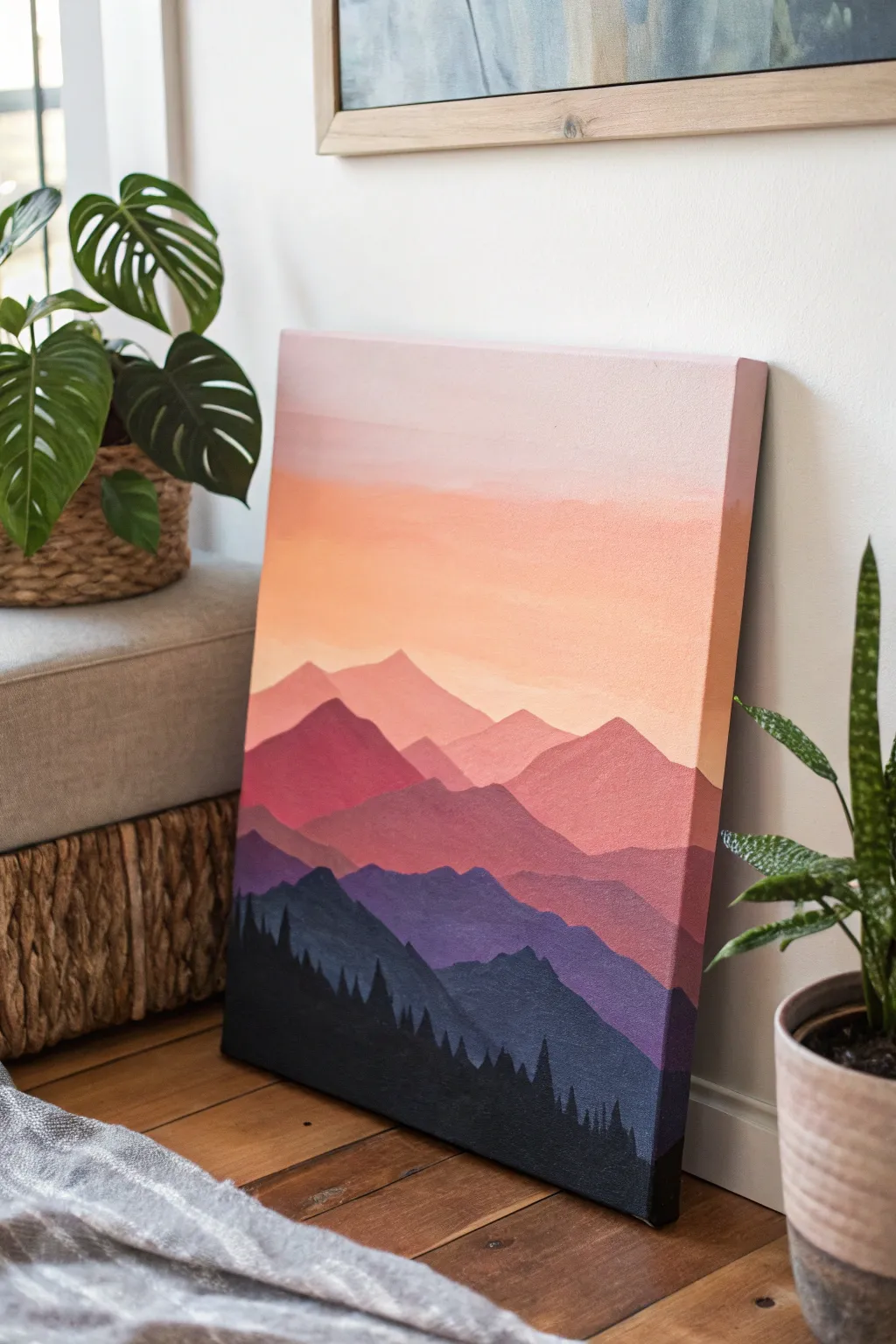 Bold mountain silhouette over a soft sunset ombre sky for a striking minimalist canvas idea