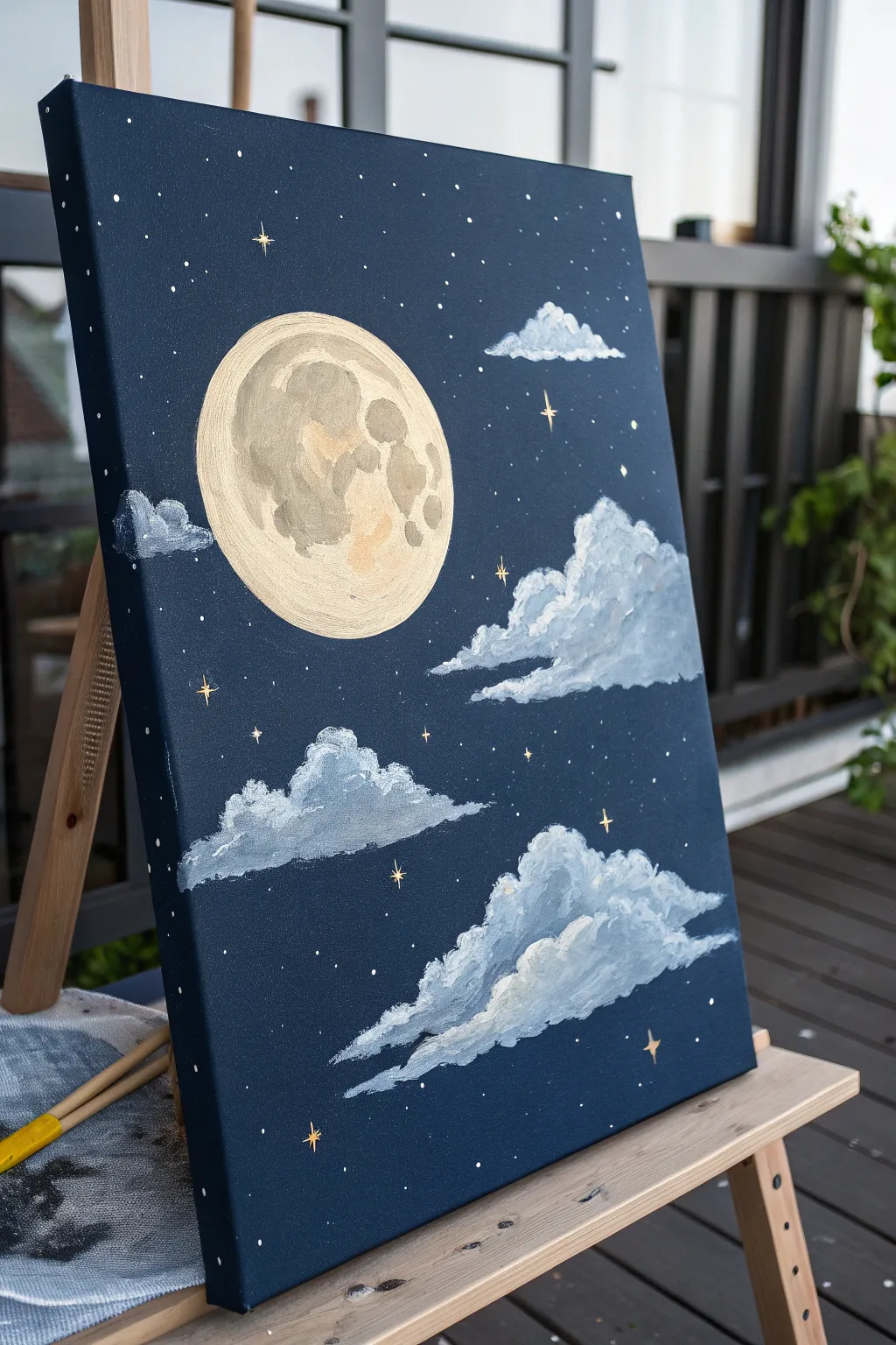 Moon and clouds on a deep navy canvas with soft glow and star speckles, minimalist boho vibe