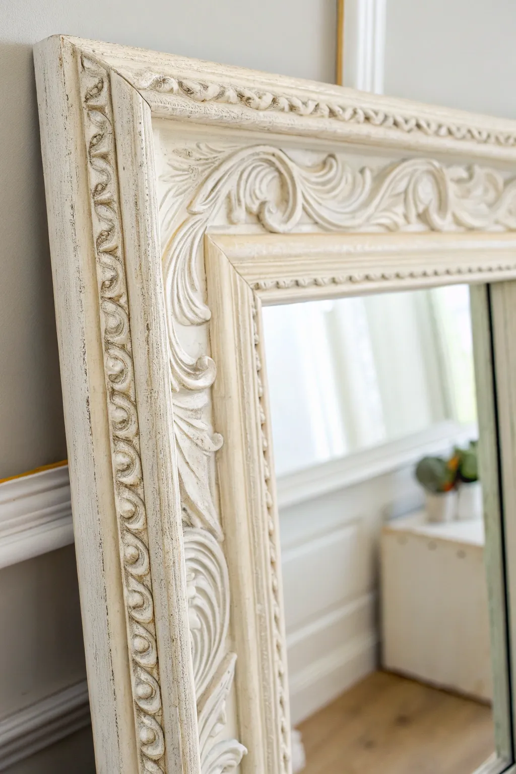 Antique white mirror frame with soft distressing and a clear before-and-after corner detail