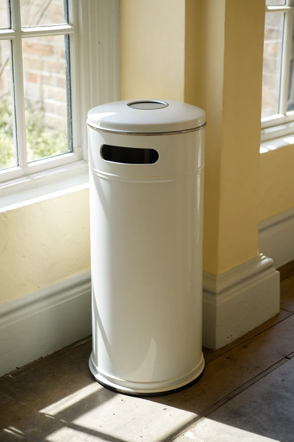 Clean monochrome trash can with a tiny accent ring for calm Scandinavian minimalism