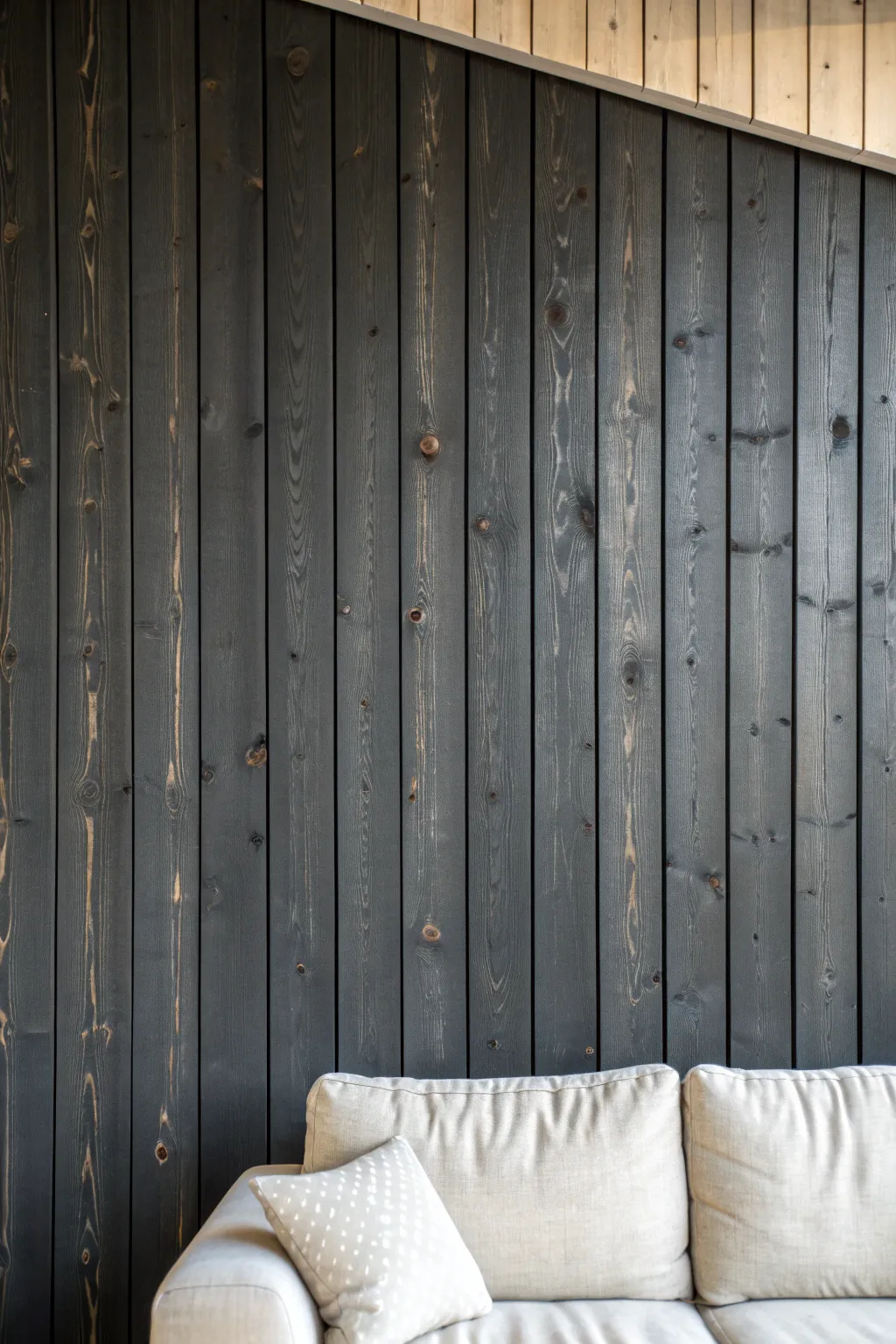Deep charcoal knotty pine makes every knot a feature, adding calm, moody depth to your space.