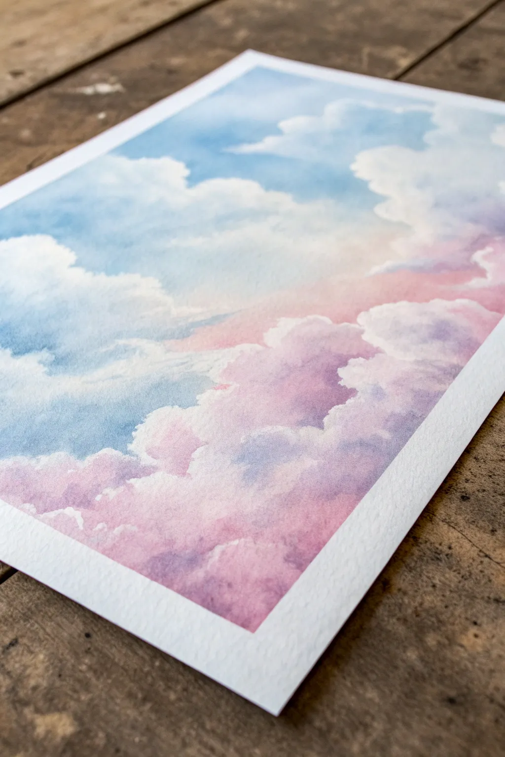 Fluffy pastel clouds in pale pink and baby blue, blended softly for an airy sky study.