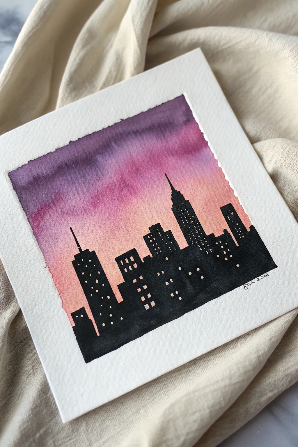 Minimal skyline silhouette set against a dreamy pink-to-purple twilight gradient, simple and bold.