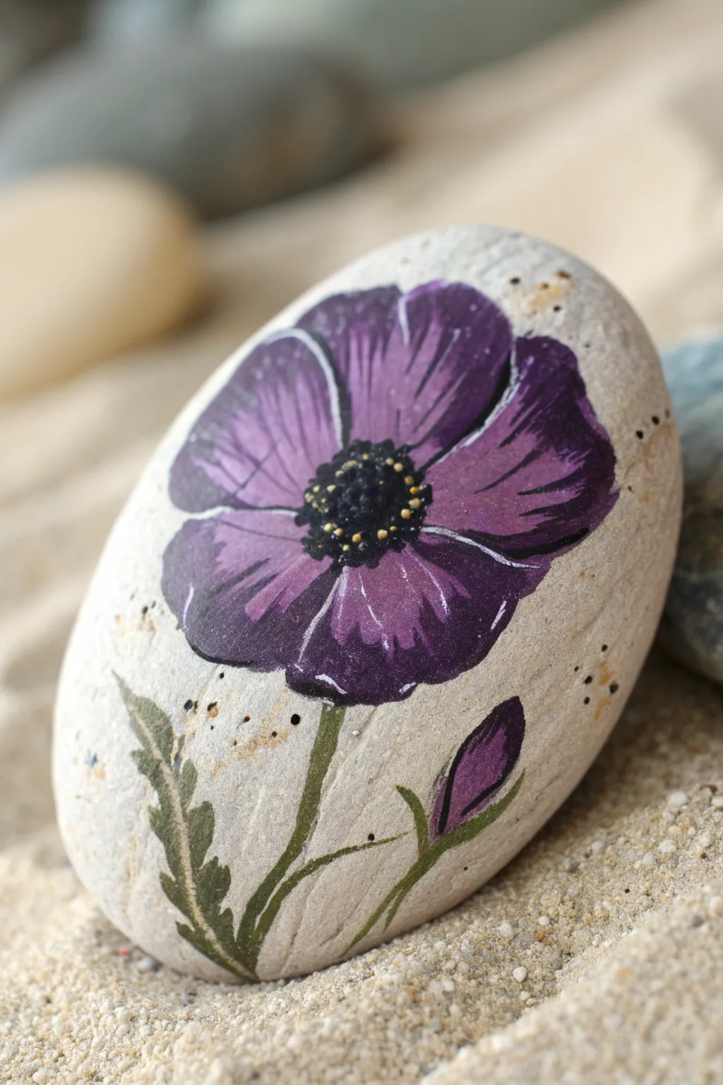 Purple poppy rock painting: bold violet petals, crisp center, minimalist boho styling.