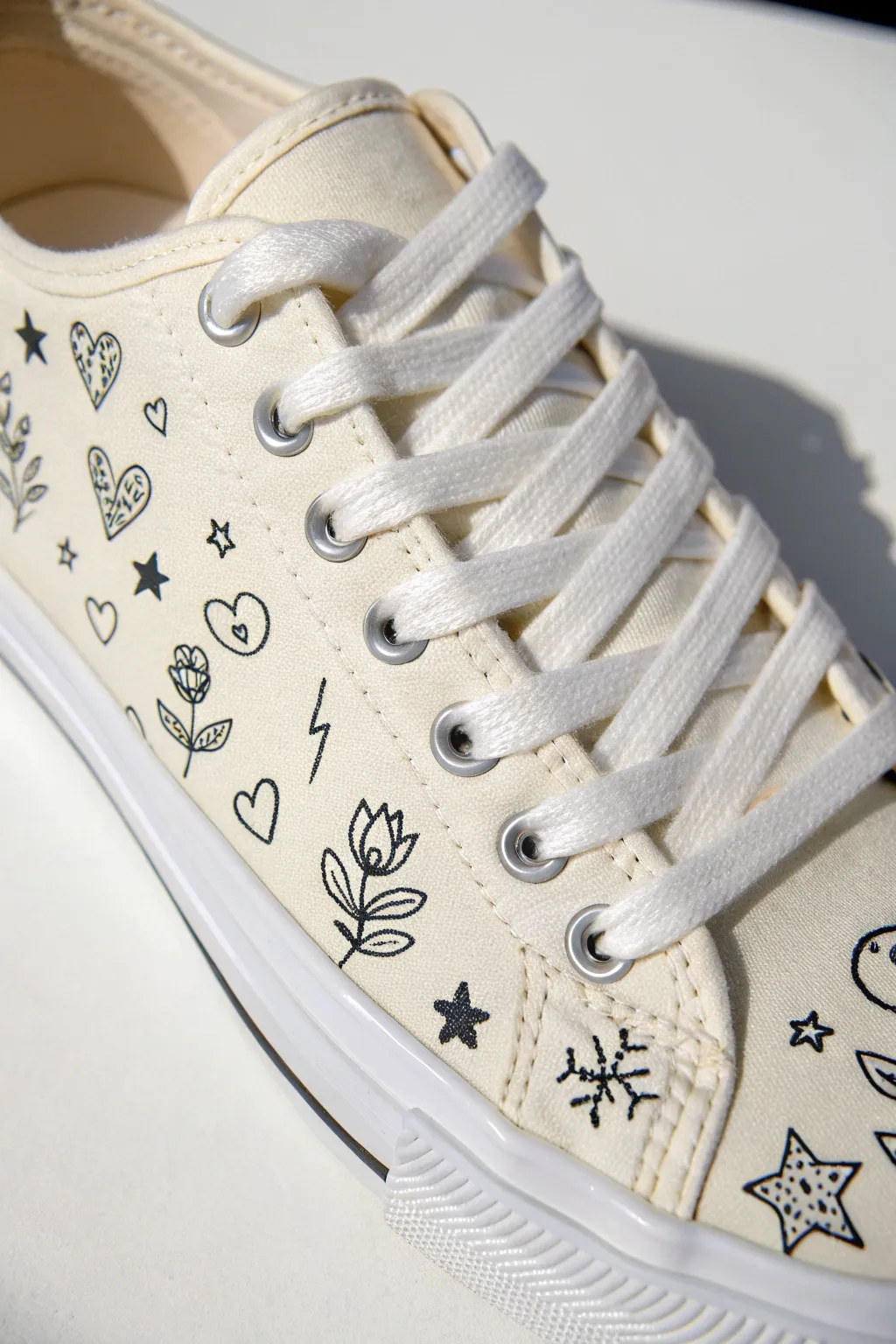 Mini doodle icons turn a simple canvas sneaker into a playful pattern that follows every seam