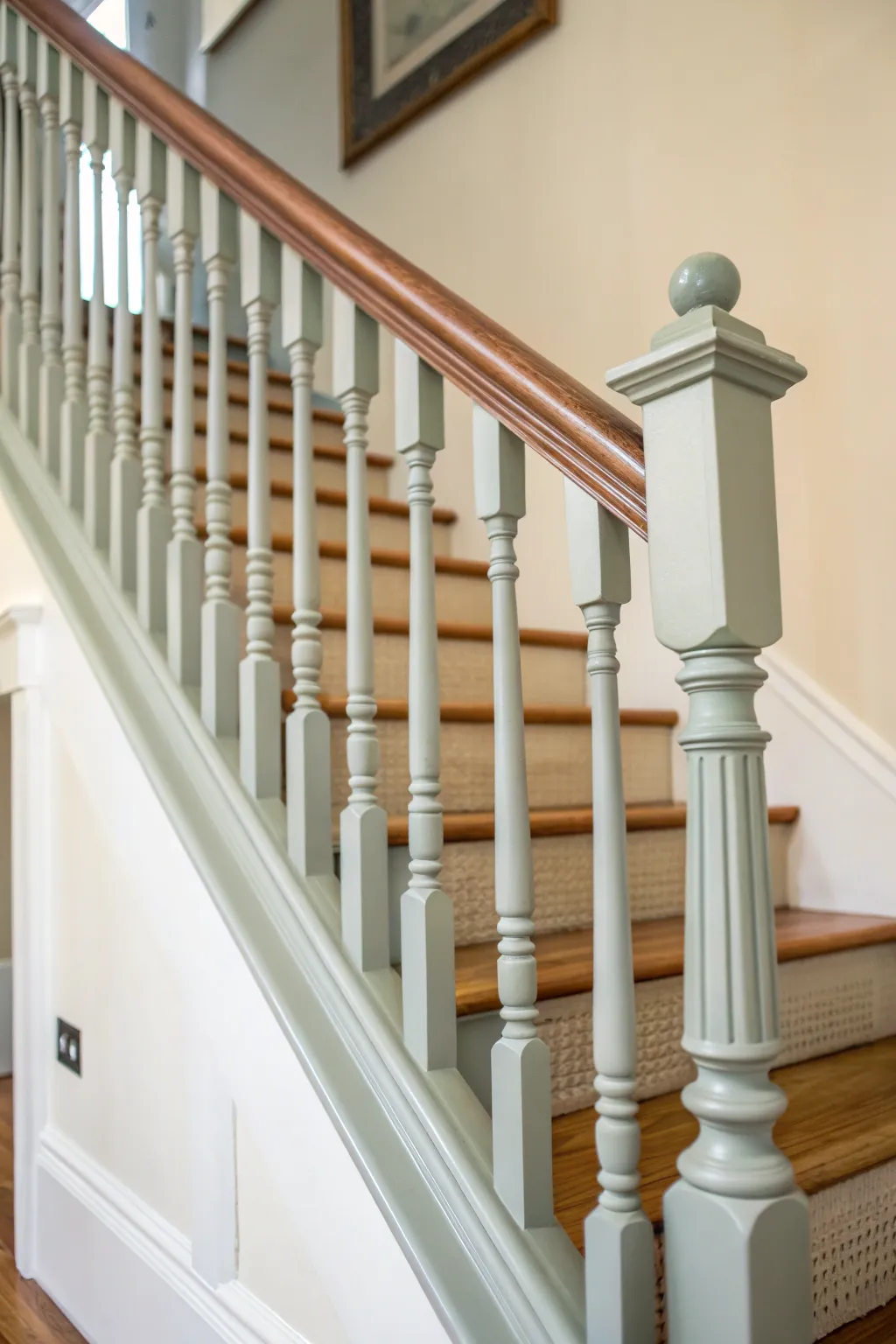 Freshly painted handrail and spindles in calm Nordic tones for an easy staircase refresh.