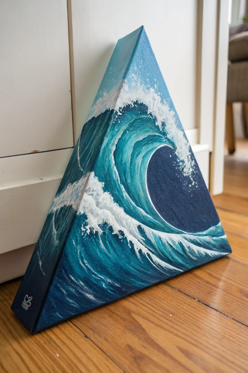 Triangle canvas idea: a curling ocean wave rising to the tip with bold dark-to-foam contrast
