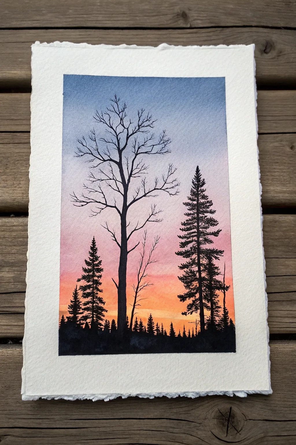Silhouette tree line over a glowing sunset gradient, a clear value study for beginners.