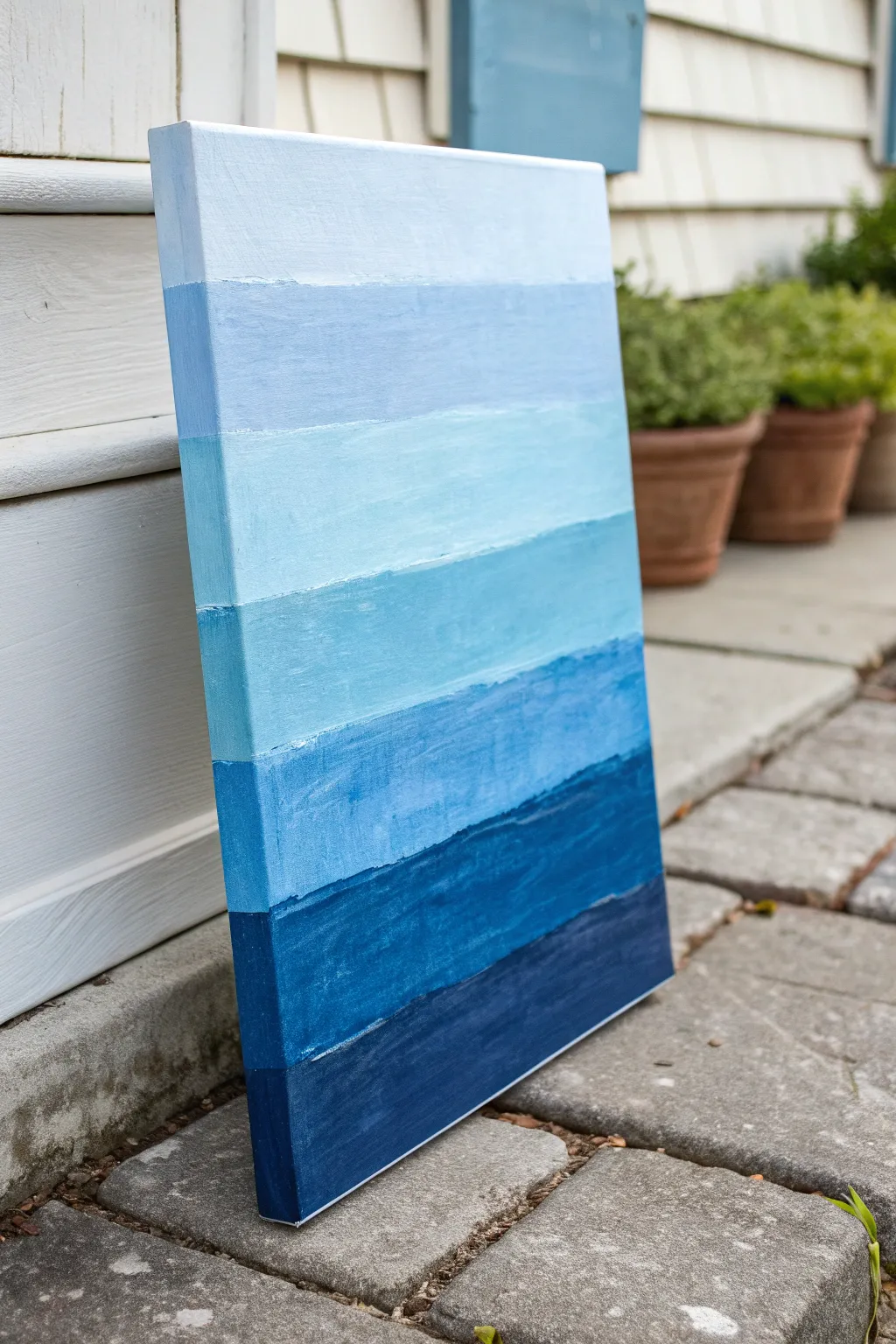 Monochrome blues from pale sky to navy, layered blocks and strokes for a simple abstract statement.