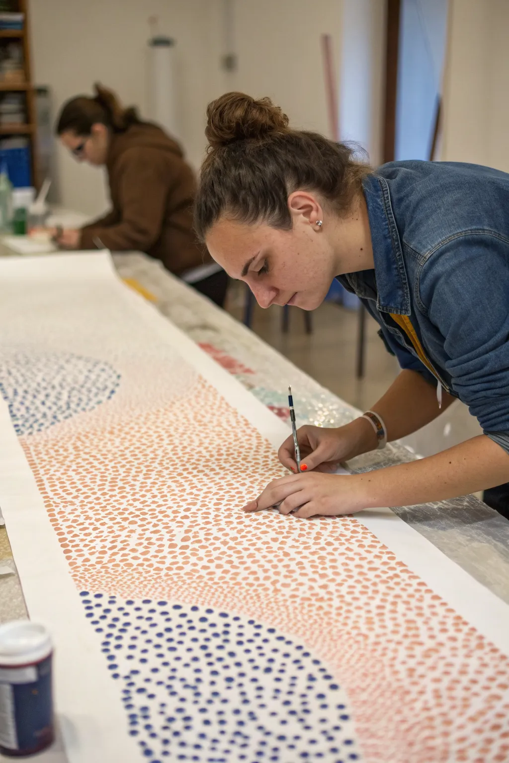 Pointillism poster teamwork: tiny dots, calm minimal palette, and hands building one artwork together