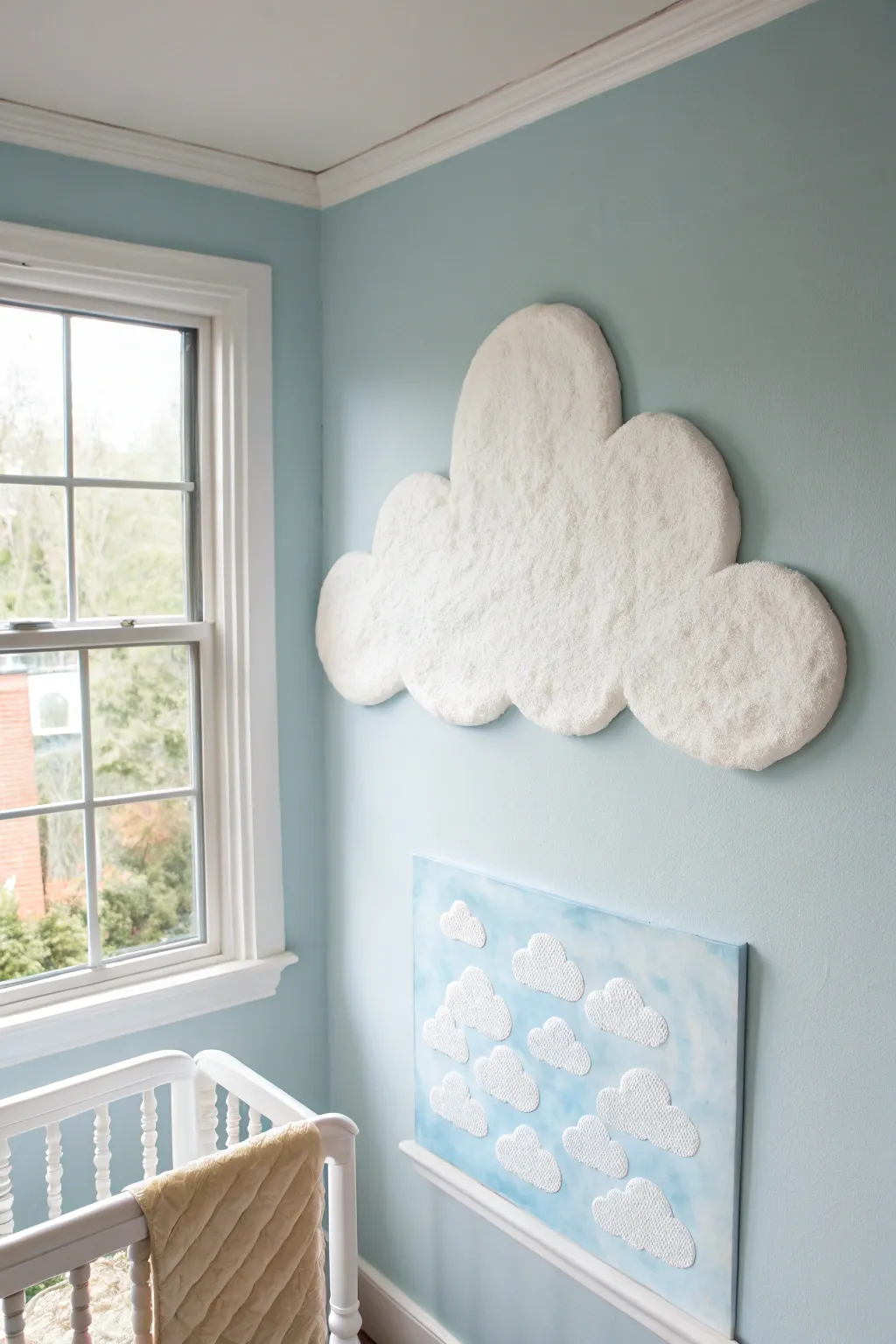 Dreamy sponged cloud texture on a pale sky wall, perfect for a calm minimalist nursery.