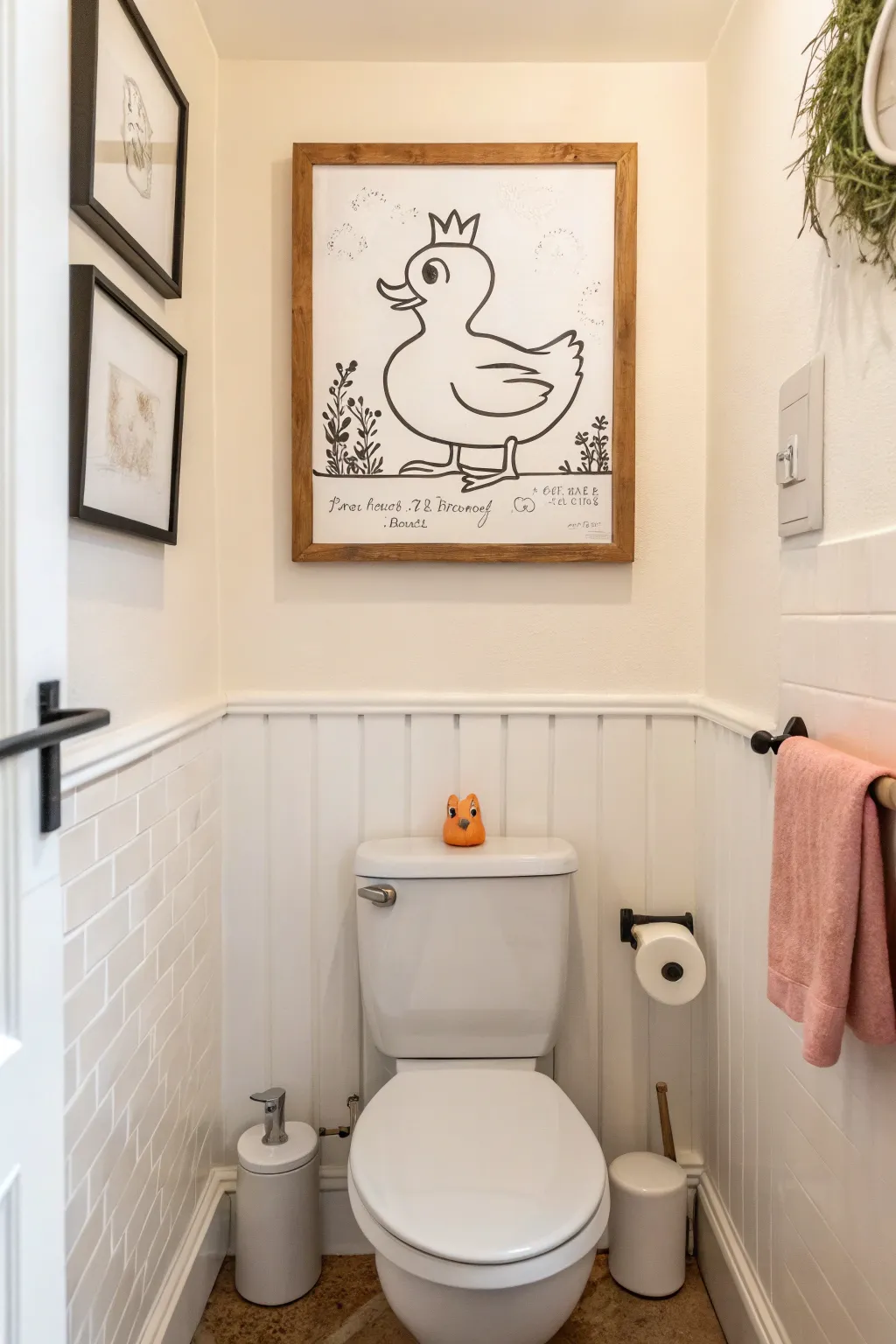 Cheeky but chic canvas art above the toilet, minimalist line illustration for a tidy powder room