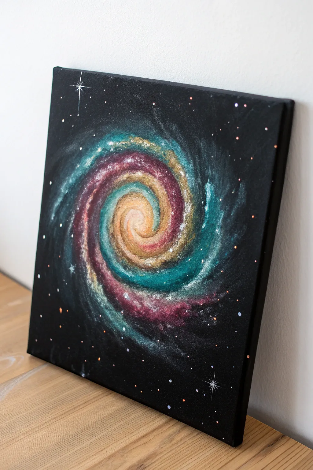 Black canvas galaxy swirl in 2–3 bright colors with soft smoky edges and delicate star speckles