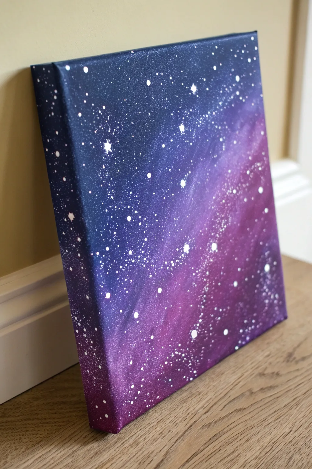 Starry night galaxy blending on canvas with indigo-to-purple fade and crisp splatter stars