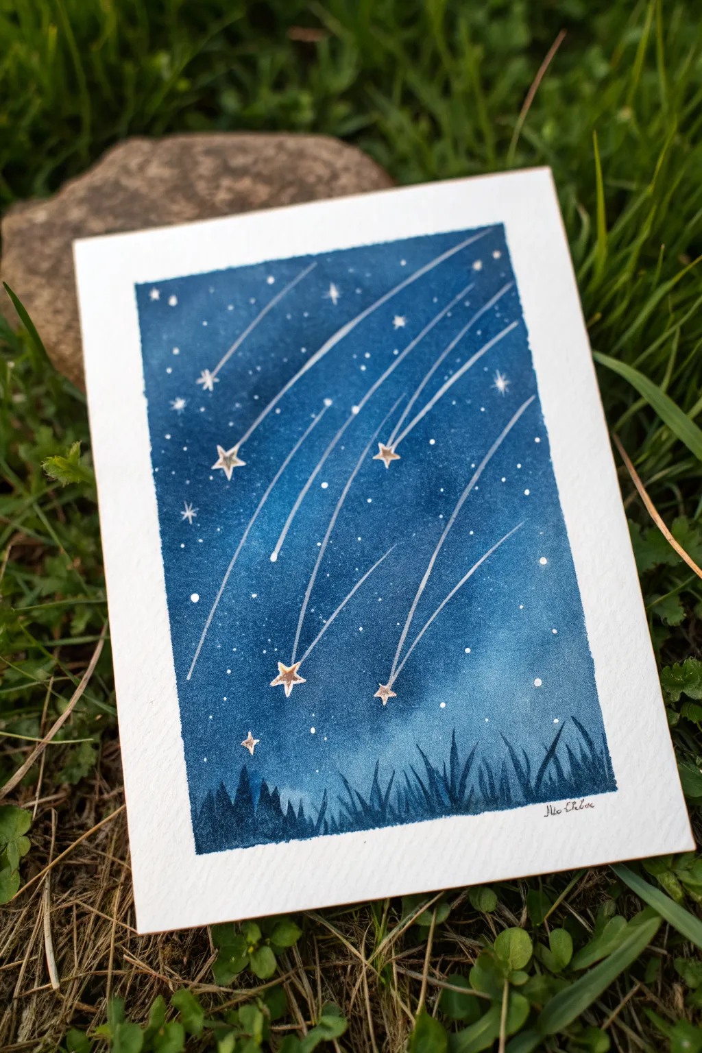 Paint arcing shooting star trails on a deep indigo sky for instant celestial motion and calm.