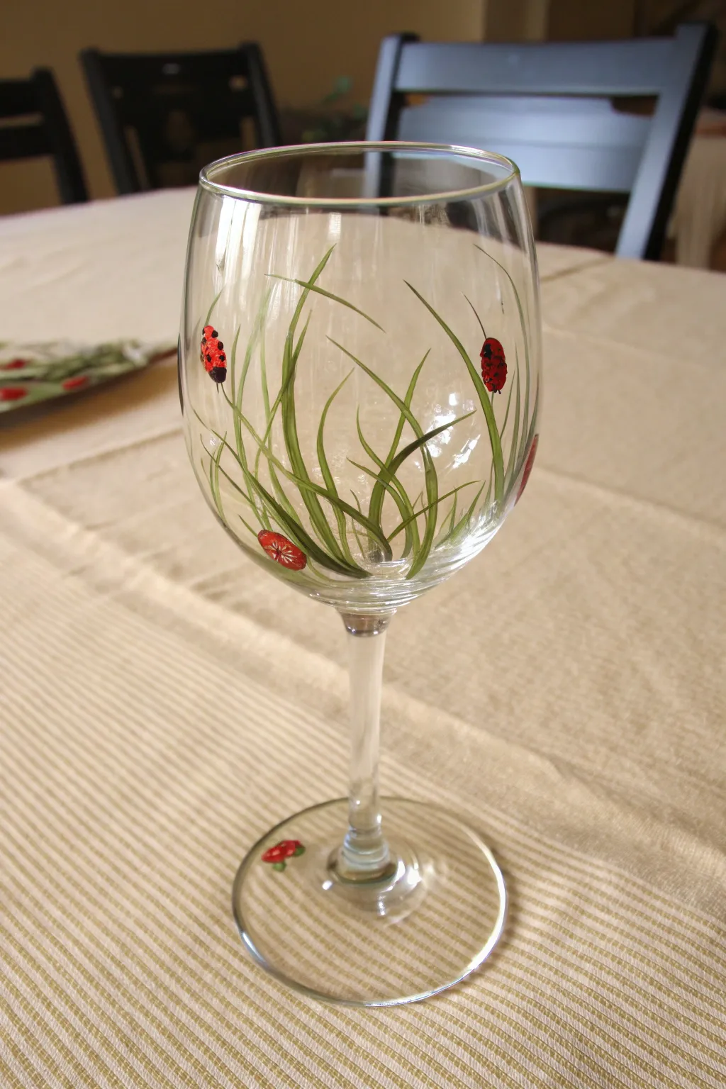 Bring a lucky touch to your table with this adorable hand-painted ladybug wine glass.