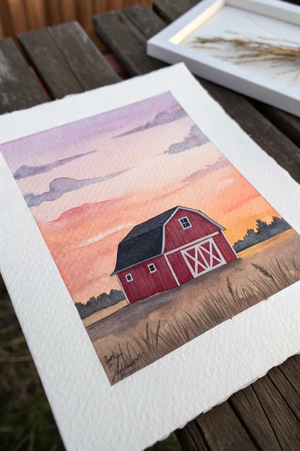 Paint a bold red barn silhouette against a peach-to-lavender sunset gradient sky.