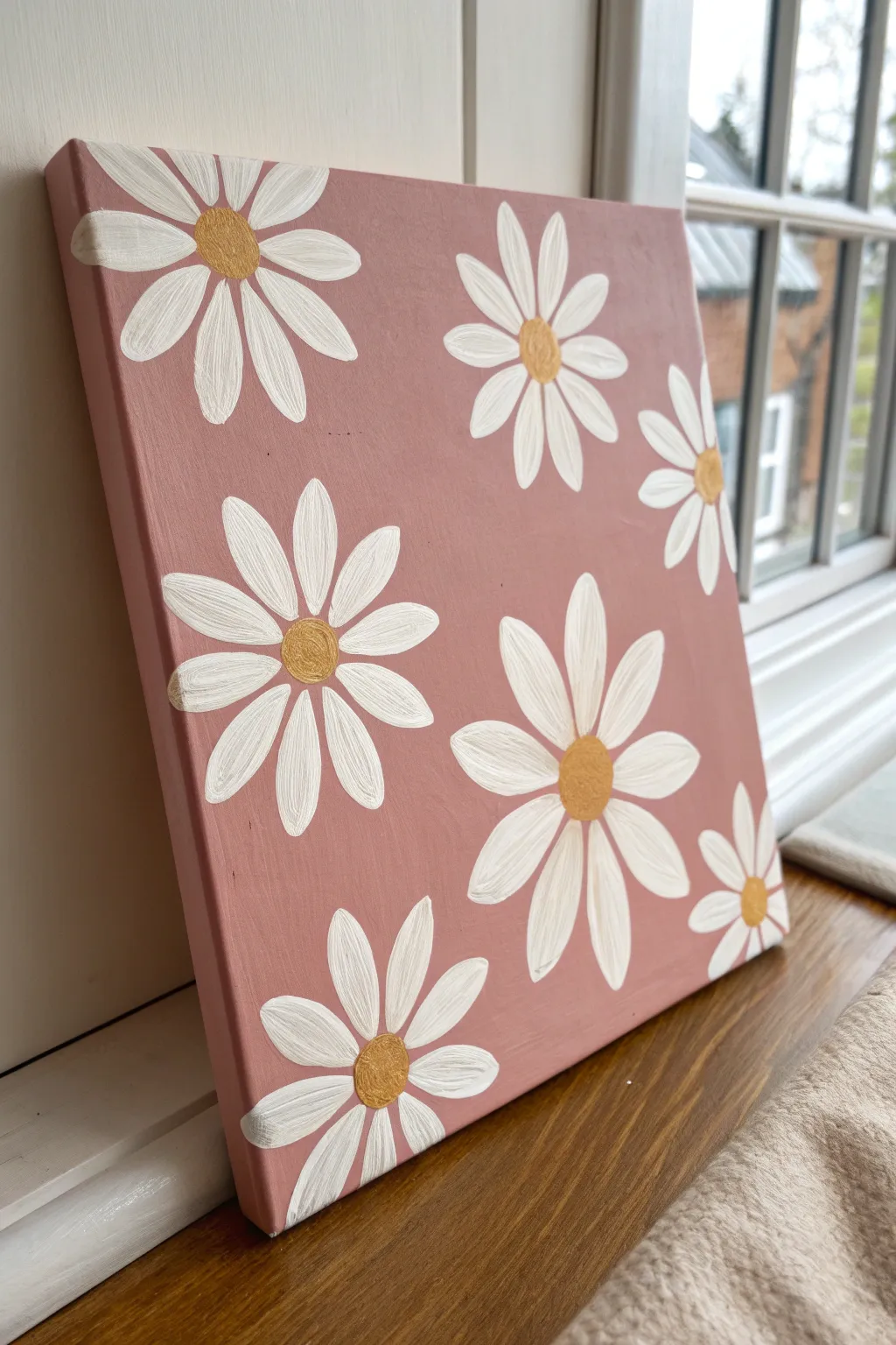 Simple pink canvas with white daisies and yellow centers for an easy, cute pattern