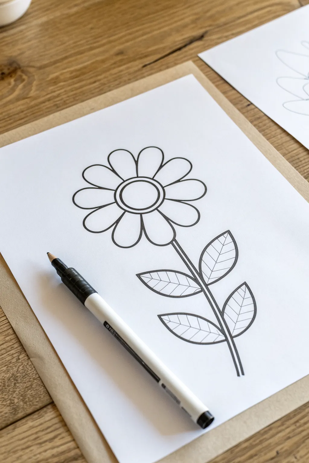 Simple five-petal flower outline on bright white paper, perfect easy drawing idea for kids