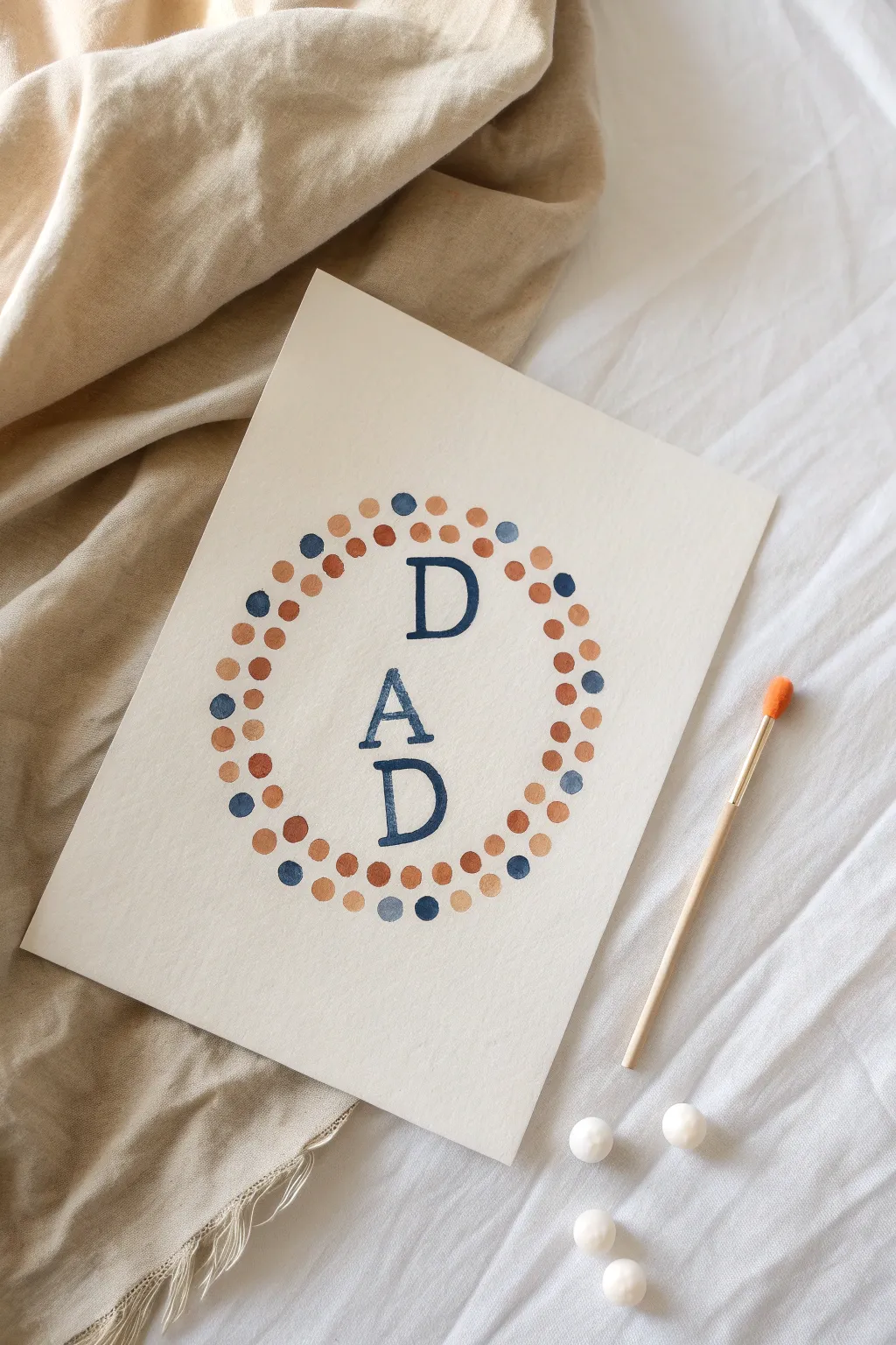 Toddler Q-tip dot painting for Fathers Day, bold DAD letters with simple high-contrast dots